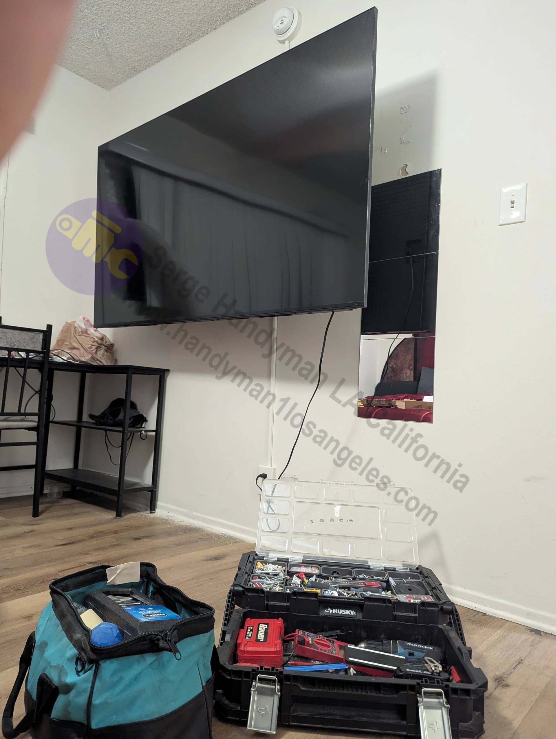 Large flat screen TV wall mounting installation in Hollywood CA